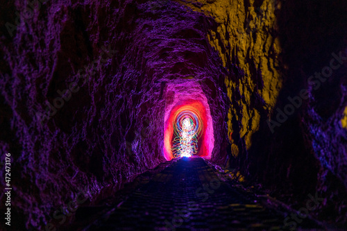 Light painting in the Historic rail tunnel, a part of an old gold mine transportation system located in Collins Drive Circuit, New Zealand photo