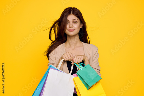 cheerful woman multicolored packs emotions shopping fashion studio model