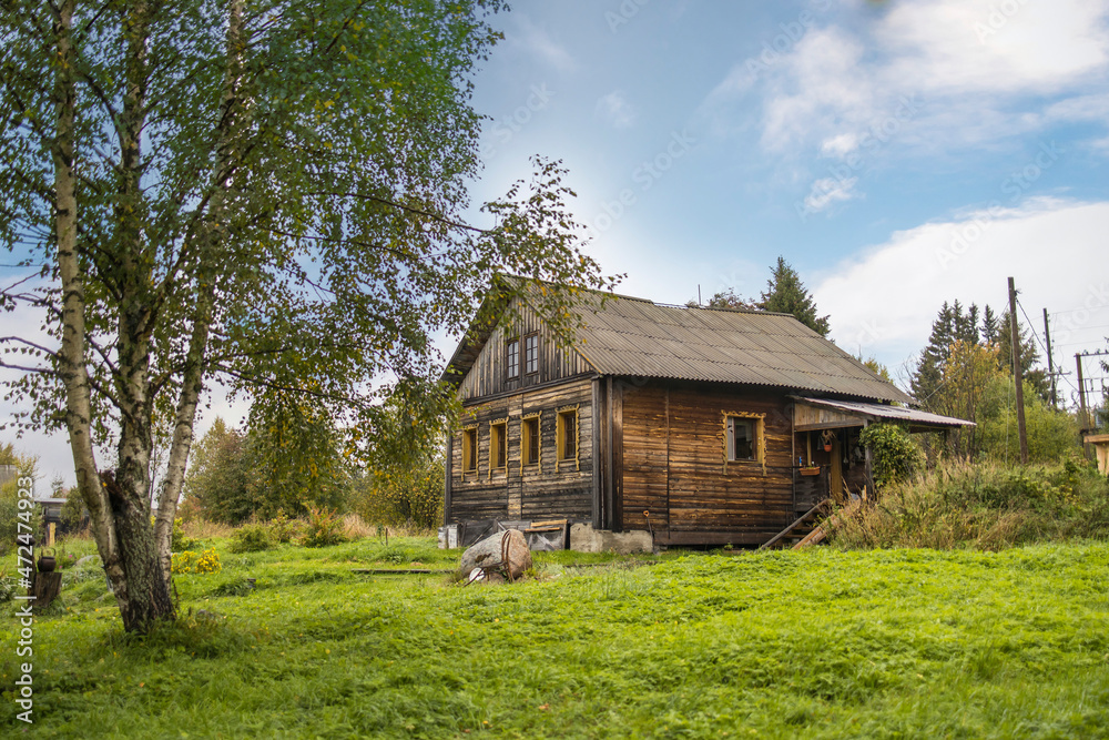 Karelia, Russia - 20 September 2021, Wooden house with a barn near the national reserve 