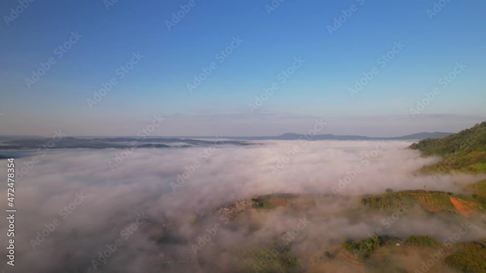 4K Aerial video Beautiful sunrise above dense clouds and fog in the morning, Cinematic drone shot.
4K Aerial video Beautiful sunrise above dense clouds and fog in the morning, Cinematic drone shot.