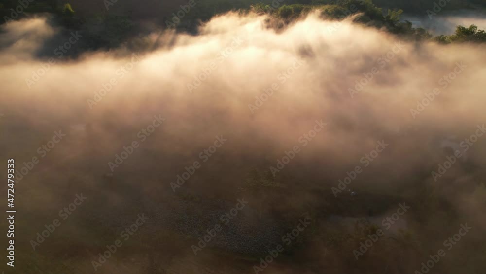 4K Aerial view of the misty sunrise in the forest. sun beam coming from behind the mountain, Tropical Rainforest in Thailand
4K Aerial view of the misty sunrise in the forest. sun beam coming from behind the mountain, Tropical Rainforest in Thailand