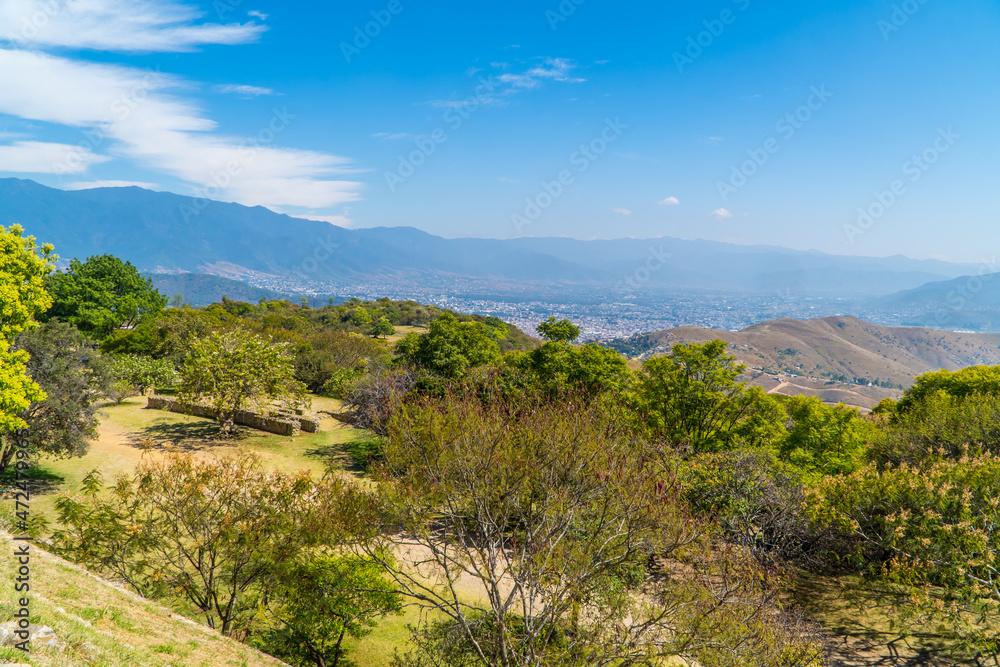 Panorama view  of mountainous landscapes with Oaxaca, Mexico cityscape in the background seen from Monte Alban