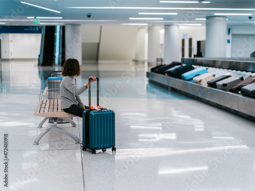 Girl waiting in baggage claim