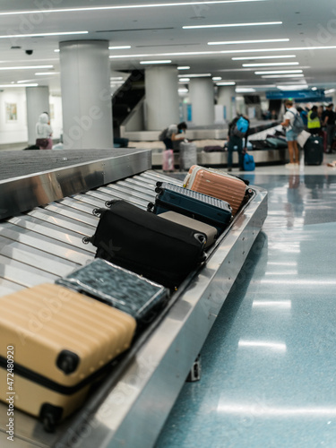 People picking up baggage at airport