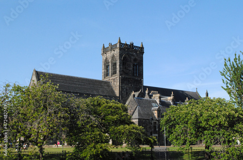 Old Stone Medieval Church against Blue Sky photo