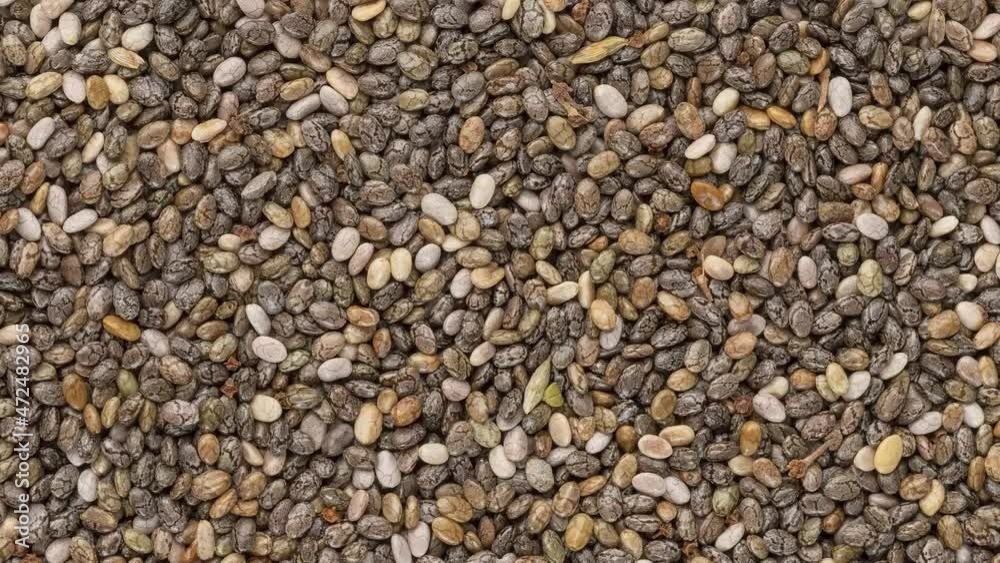 Closeup, top view of chia seeds. Food backdrop Closeup, top view of chia seeds. Food backdrop