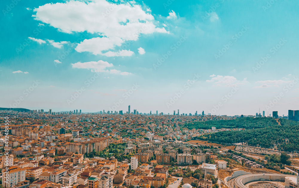 Istanbul downtown aerial drone panorama view at day time with skyscrapers and city skyline. Urban city life under beautiful sky.