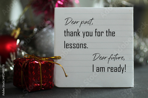 Dear past, thank you for the lessons. Dear future, i am ready. A self letter on a notepaper and red Christmas gift box with Christmas decorations. photo