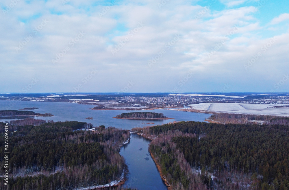Aerial view of the forest lake. Landscape nature in winter