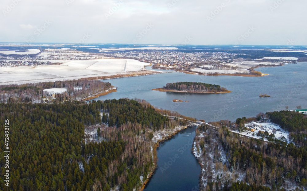 Aerial view of the forest lake. Landscape nature in winter