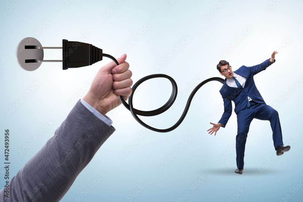 Businessman being powered by electric power