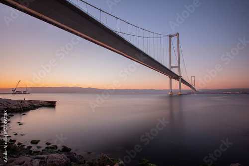 Magnificent sunrise from under Osman Gazi Bridge , Turkey photo