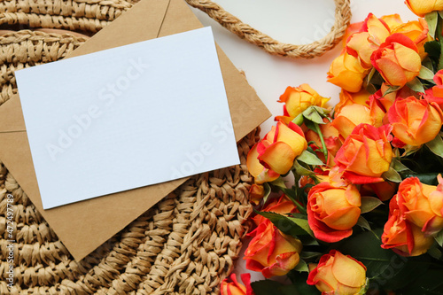bouquet of orange roses and white blank for text