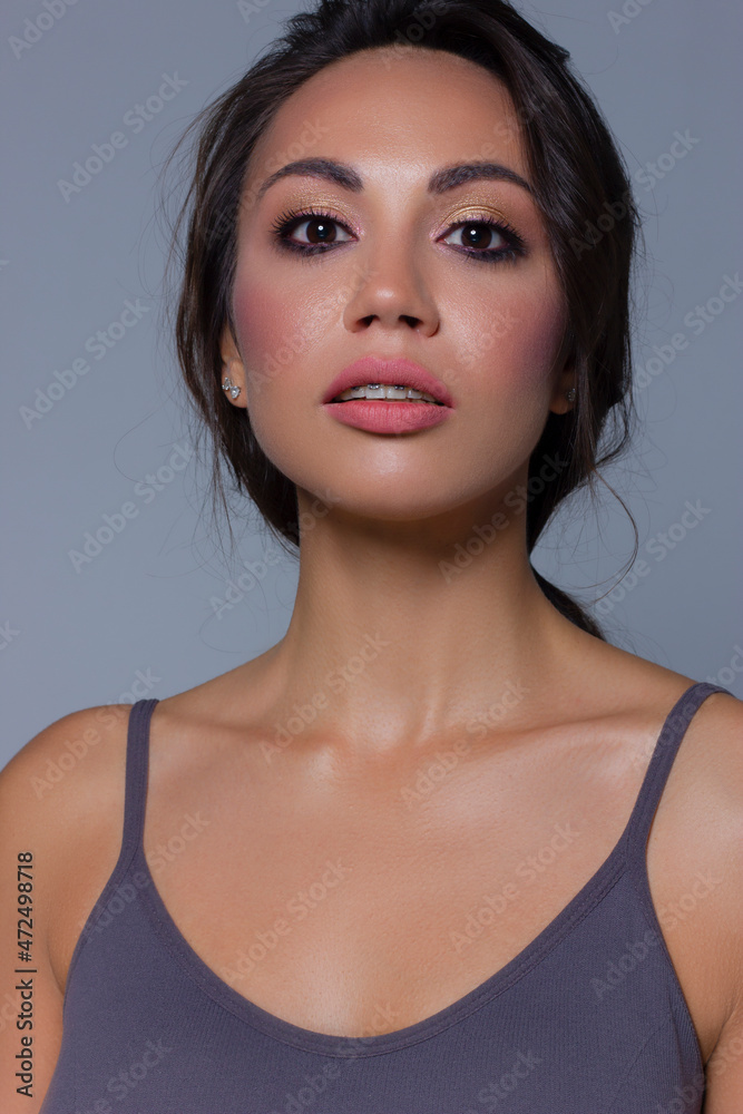 Beautiful brunet model woman face with brown eyes and perfect make-up . Portrait of beauty young brunet girl with pink lips. Female face with clear skin close-up. Skincare Beautiful brunet model woman face with brown eyes and perfect make-up . Portrait of beauty young brunet girl with pink lips. Female face with clear skin close-up. Skincare