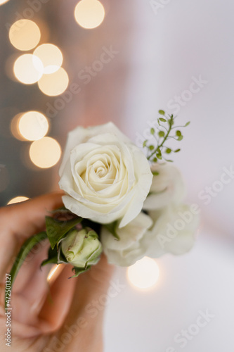 Fototapeta Naklejka Na Ścianę i Meble -  White rose boutonniere for the groom