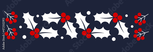 Christmas holly berries decoration on dark background.