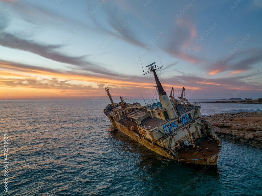 Cyprus - Abandoned shipwreck EDRO III in Pegeia, Paphos, Cyprus from drone view at amazing sunset time