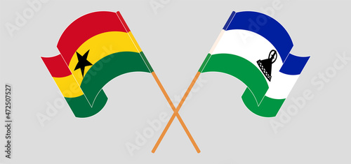 Crossed and waving flags of Ghana and Kingdom of Lesotho