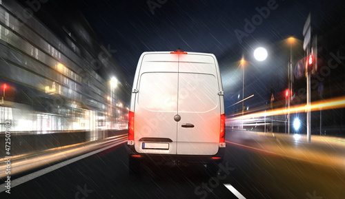 Parcel Express carrier in the city at night with high speed motion.