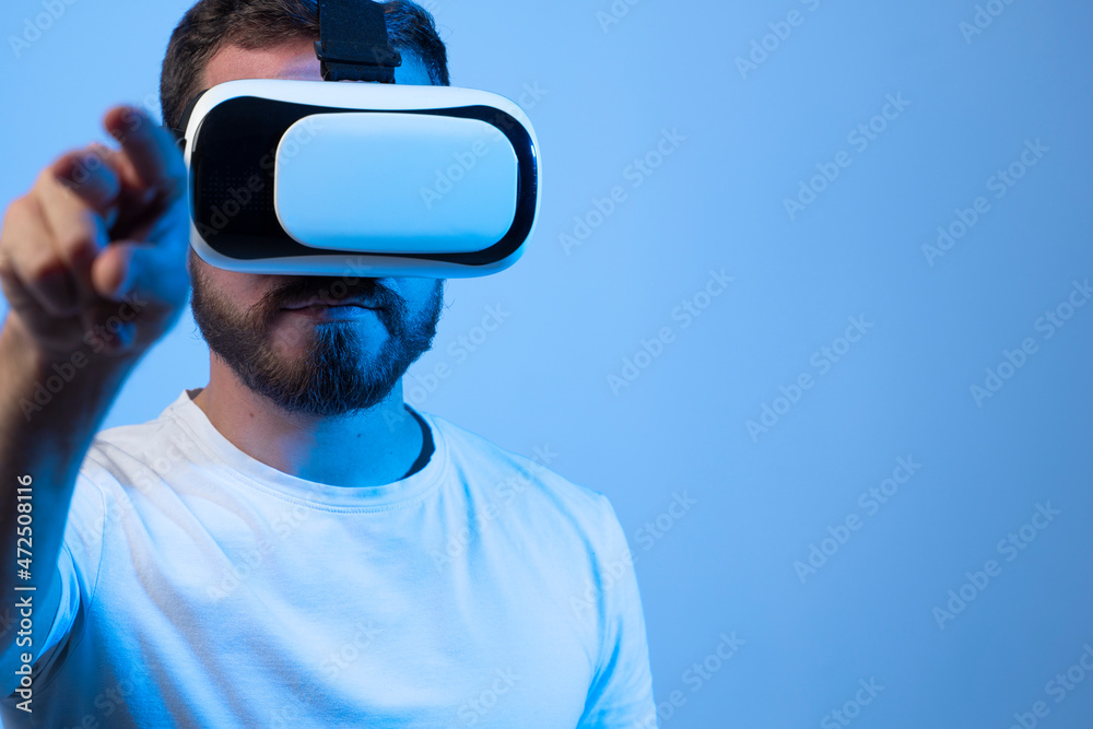 Addicted young man playing a virtual reality video game in a metaverse. Addicted young man playing a virtual reality video game in a metaverse.