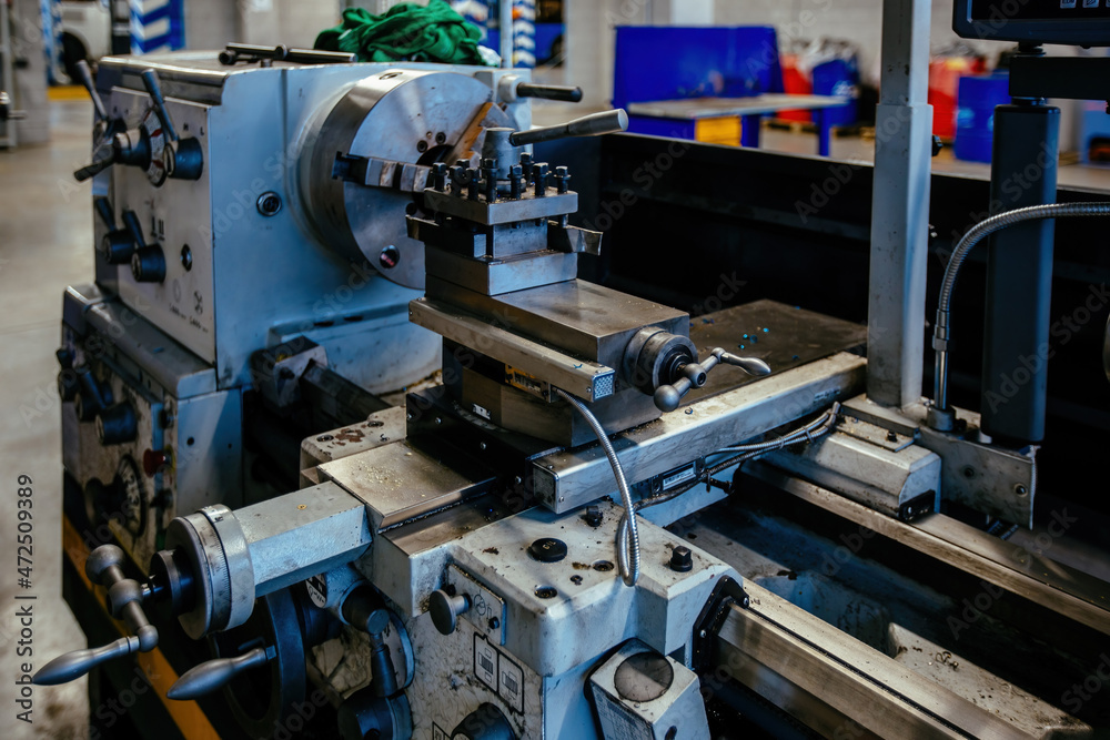 Lathe in the metalworking workshop, close up Lathe in the metalworking workshop, close up