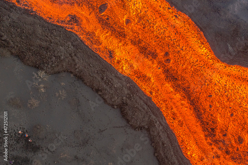 Aerial top down view of lava floating down the Volcan Cumbre Vieja, a volcano during eruption near El Paraiso town, Las Manchas, La Palma Island, Canary Islands, Spain.