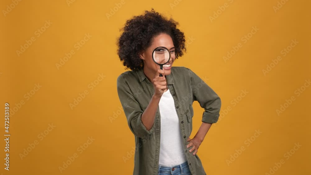 Lady watch magnify lupe tongue out isolated mustard color background