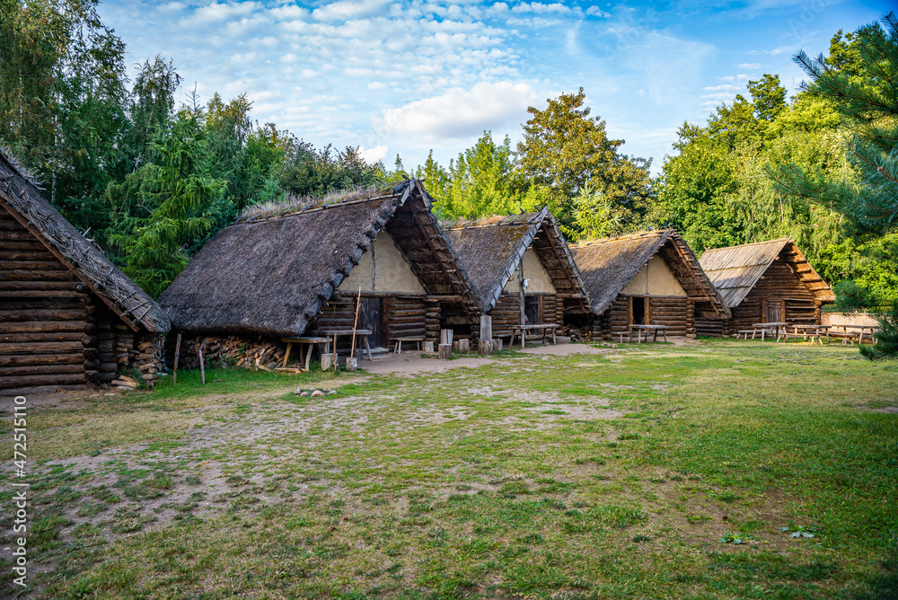 Biskupin, Poland - August 09, 2021. Archaeological site and a life-size model of a late Bronze Age fortified settlement in north-central Poland