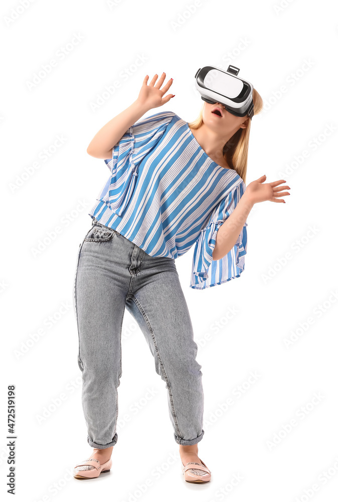 Young blonde woman in VR glasses on white background Young blonde woman in VR glasses on white background