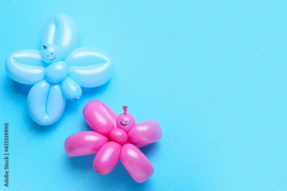 Butterflies made of balloons on blue background Butterflies made of balloons on blue background