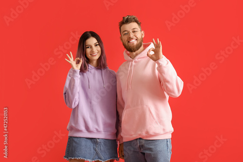 Cool young couple in hoodie...