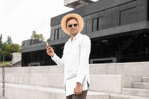 Young man in sunglasses wit...