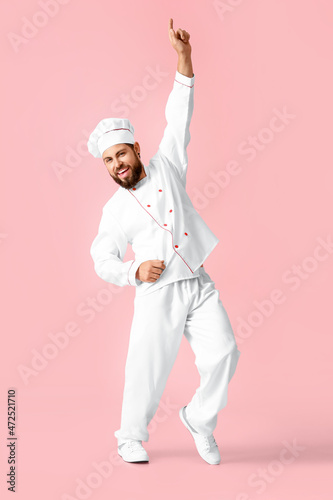 Dancing male chef on pink b...