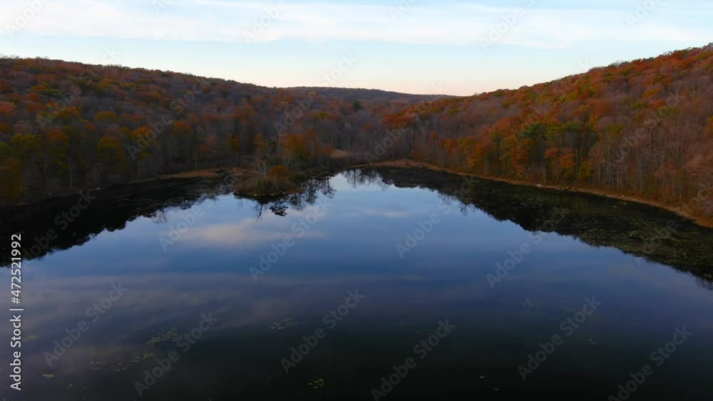 Aerial View Of Lake In Autumn Forest, The Drone Captures A Relaxing Fall Mood Aerial View Of Lake In Autumn Forest, The Drone Captures A Relaxing Fall Mood