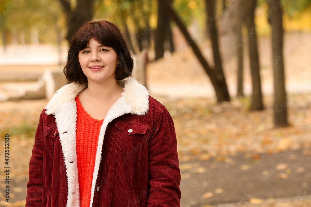 Portrait of beautiful brunette woman in autumn park Portrait of beautiful brunette woman in autumn park