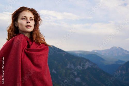 woman with red plaid on nature in the mountains vacation adventure