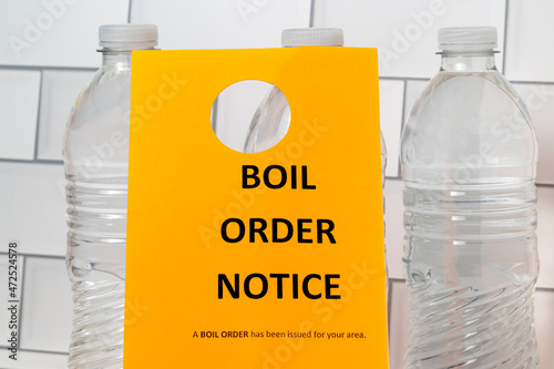 Boil order notice and bottled water. Clean, contaminated, dirty or broken drinking water supply concept.