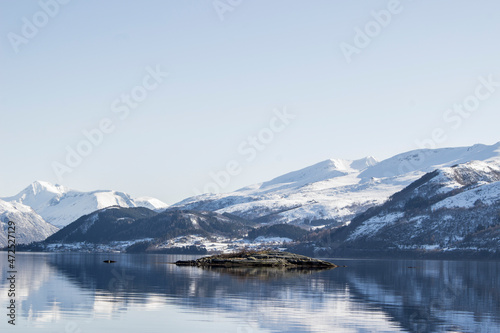 Fjord in Norway with snowy mountains