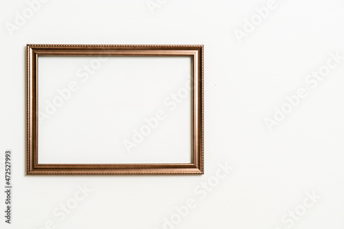 empty picture frame on white wall background