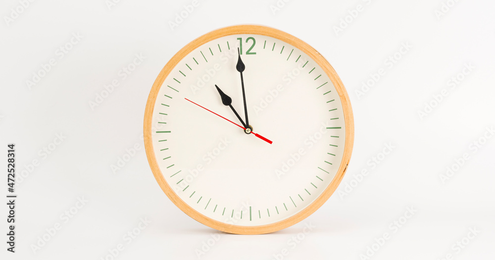 White wall clock isolated 11.00 am or pm. on white background. White wall clock isolated 11.00 am or pm. on white background.