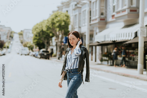 Photography Casual woman crossing the street in downtown, San Francisco