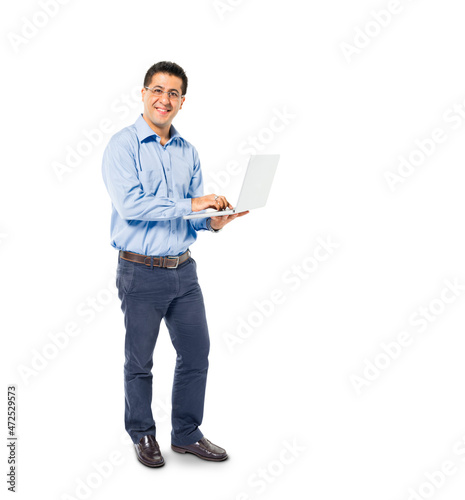 A Smart Casual Mans Standing while using his Laptop