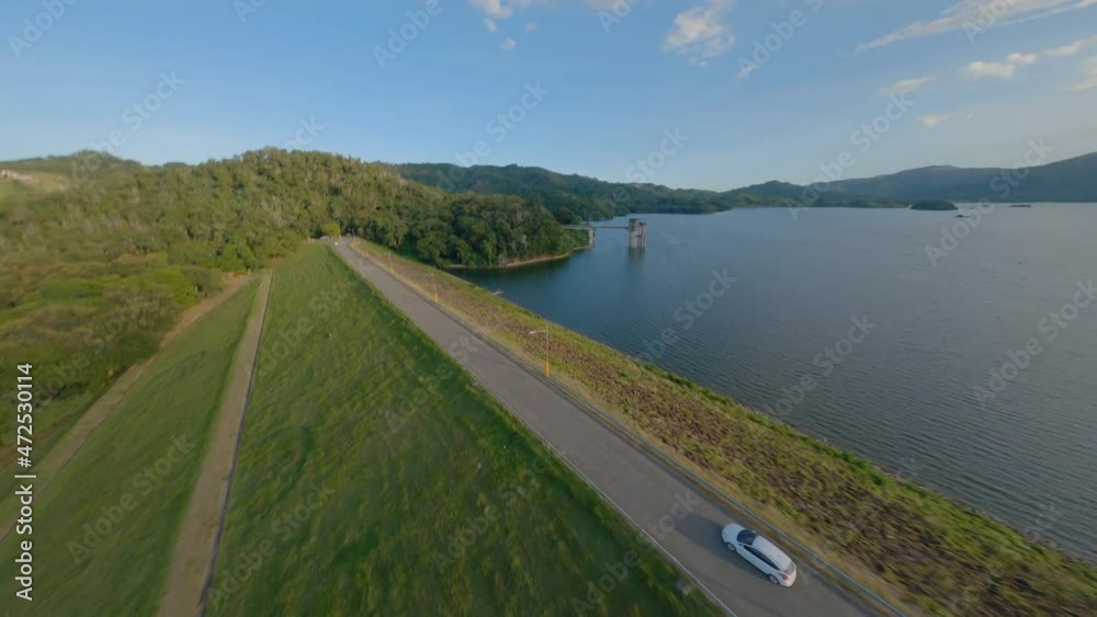 Aerial acrobatic drone fpv over road of Hatillo dam edge, Dominican Republic Aerial acrobatic drone fpv over road of Hatillo dam edge, Dominican Republic