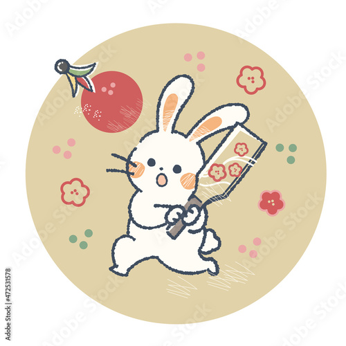 正月に羽根つきをするうさぎ