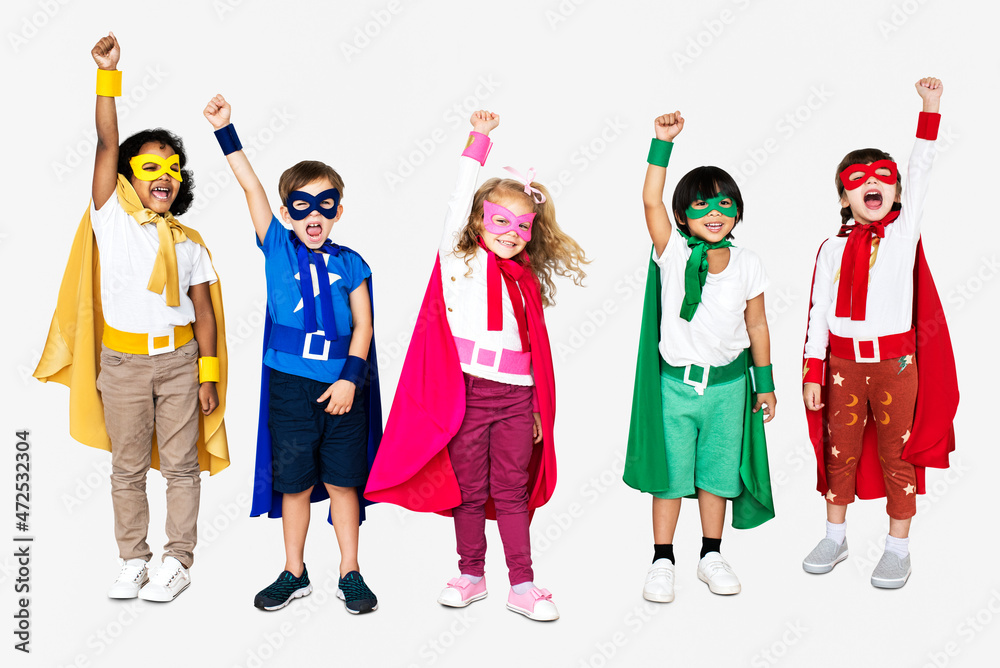 Cheerful kids wearing superhero costumes