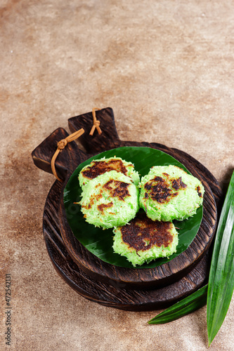 Wingko pandan is javanese traditional pancake made from grated coconut, gluotinous fluor and sugar, flavour with pandan paate. photo