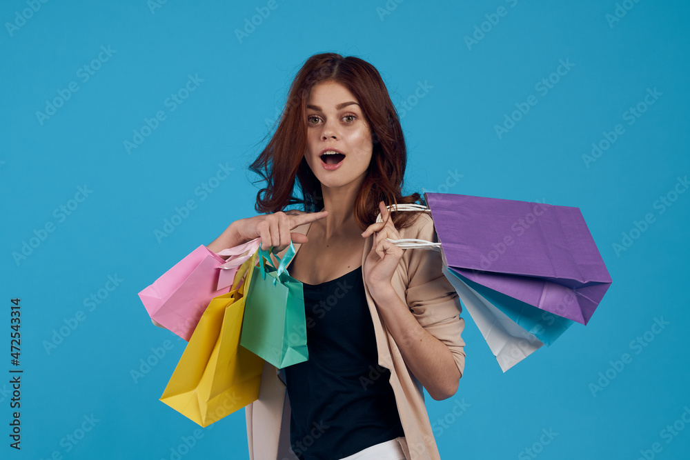 cheerful woman with packages in hands Shopaholic isolated background