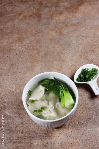 Sup pangsit or wonton soup is Chinese wonton dumpling in clear soup