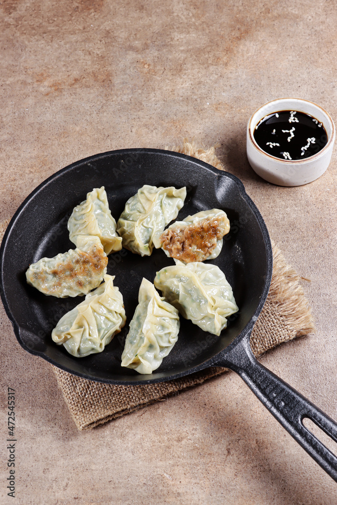 Gyoza is Japanese dumplings with chicken and vegetables. Gyoza is Japanese dumplings with chicken and vegetables.