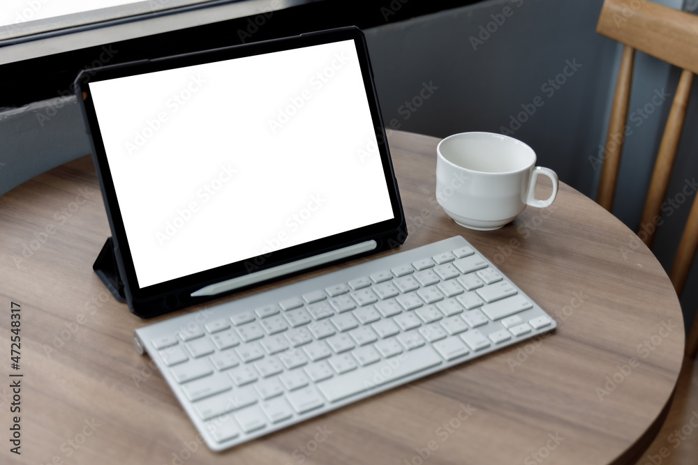 Blank screen laptop computer modern man use room laptop with blank white desktop screen with coffee cup on wooden table in cafe Blank screen laptop computer modern man use room laptop with blank white desktop screen with coffee cup on wooden table in cafe